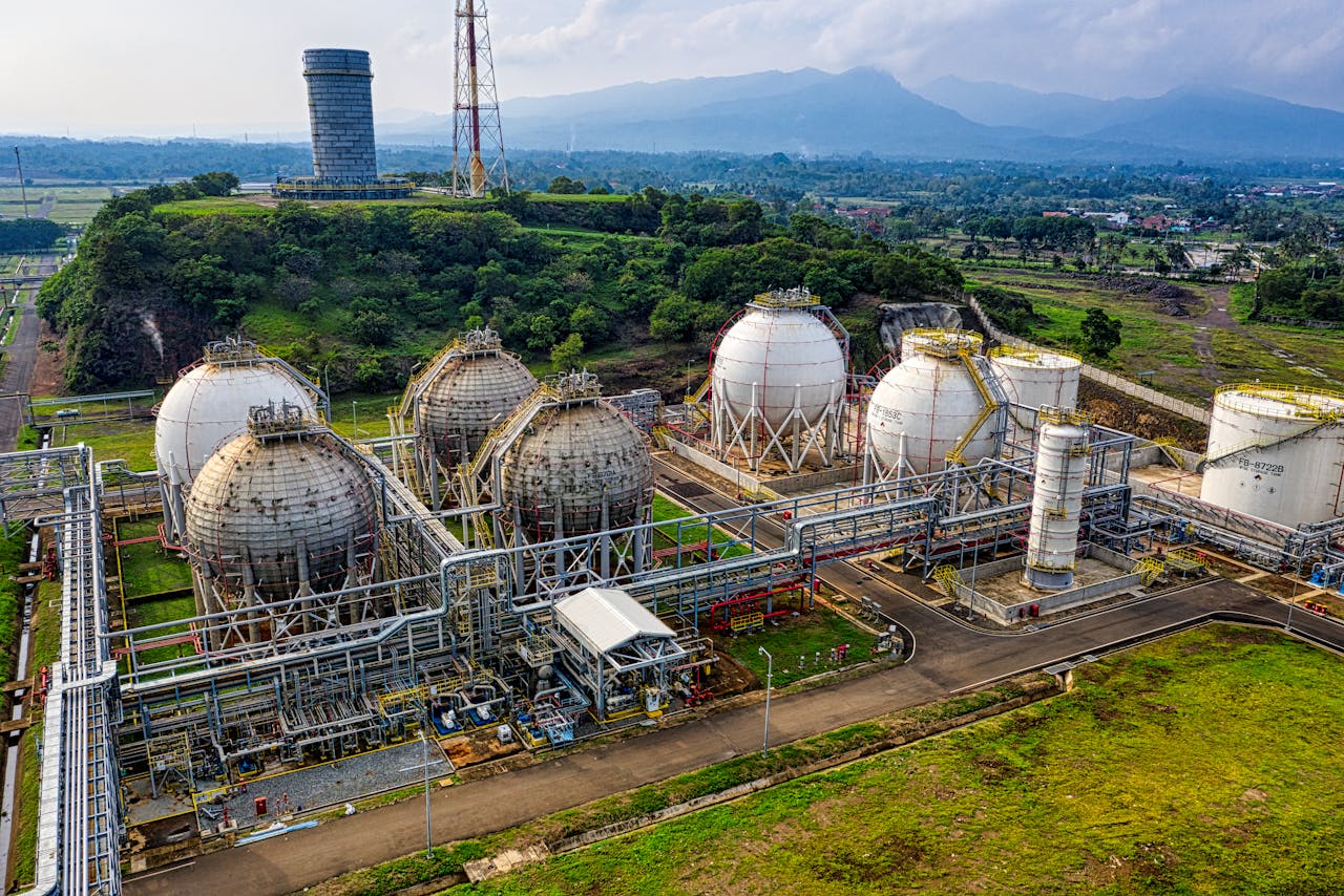 our-story Aerial shot of a power plant with storage tanks in lush Banten, Indonesia offers an impressive scale.